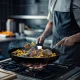 Τηγάνι Tefal Ingenio Excellence πάνω σε φλόγα εστίας υγραερίου, μαγείρεμα σε εστία υγραερίου