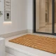 Πατάκι εισόδου MRShome 59x39cm με ανάγλυφο γεωμετρικό σχέδιο σε φυσική απόχρωση, τοποθετημένο σε εξώπορτα.
